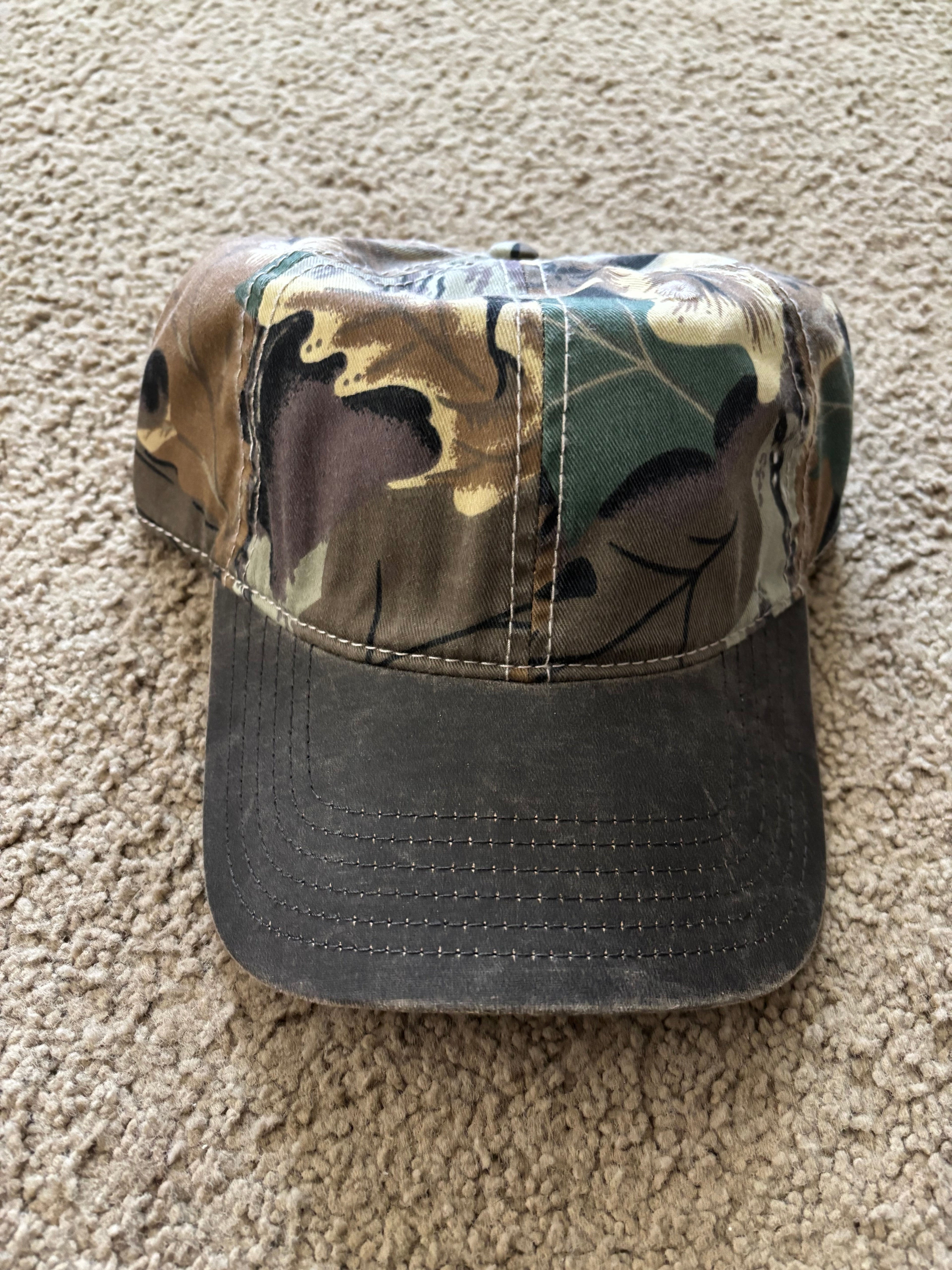 Camo crown and black bill cap